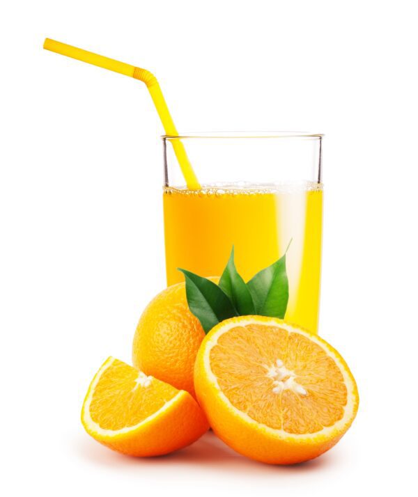 Glass of orange juice and the oranges