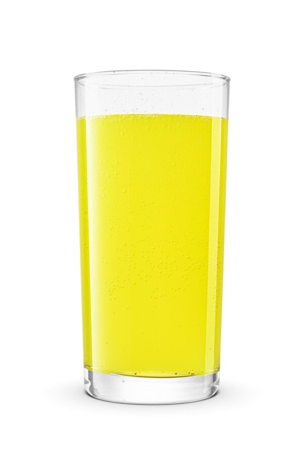 Glass of yellow soda soft drink isolated on white. Sweet taste of candy, lemon or cream soda.